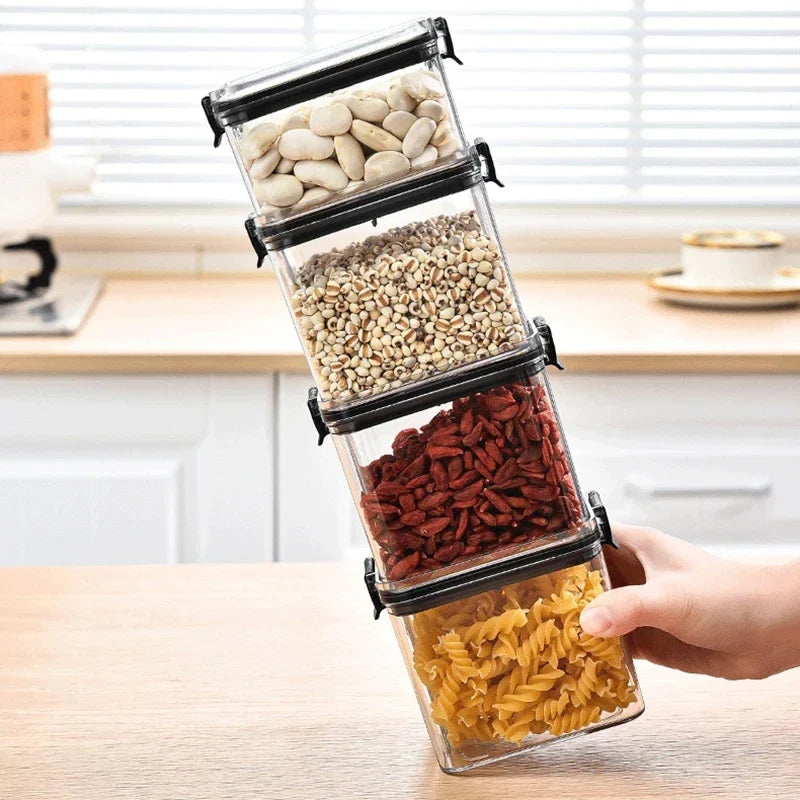 Kitchen storage jar set: clear canisters with black latch lids, filled with nuts, beans, and pasta