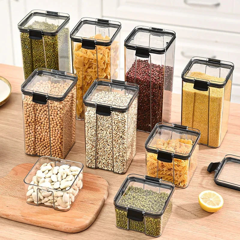 Kitchen storage jar set: clear canisters with black latch lids, filled with assorted dry ingredients