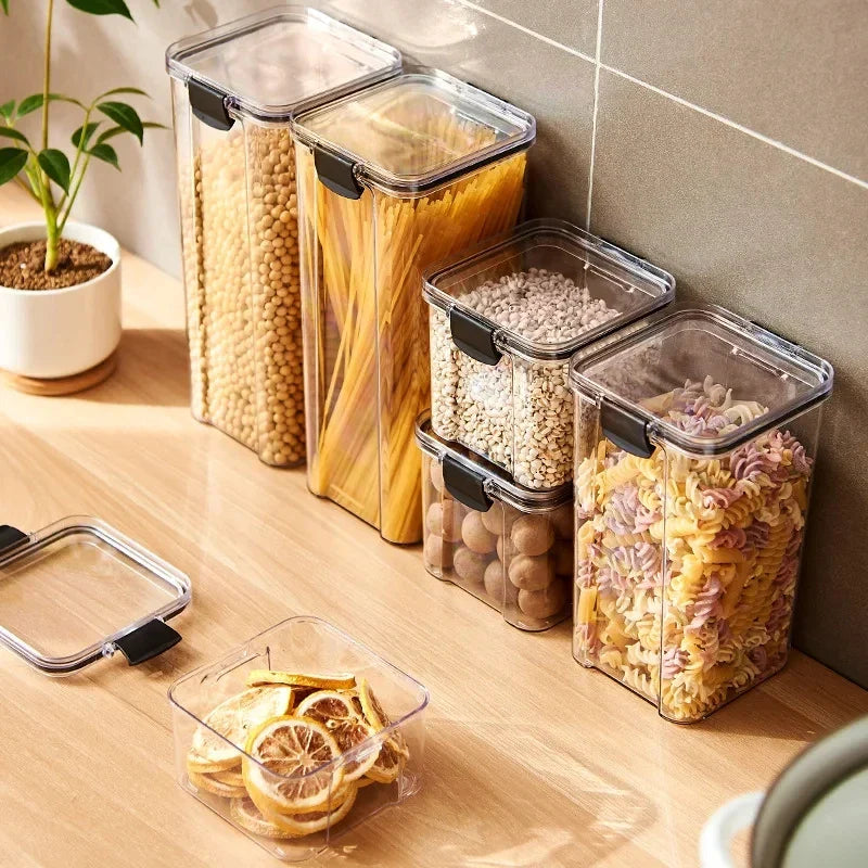 Kitchen storage jar set: clear canisters with black latch lids, filled with grains and pasta